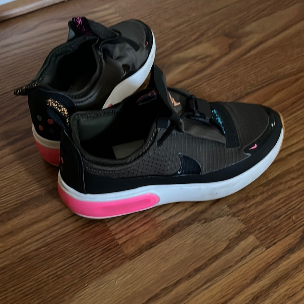 Nike thick bottoms. Dark green with black and hot pink on back heel